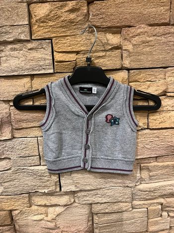 Gilet sans manches 1 mois neuf