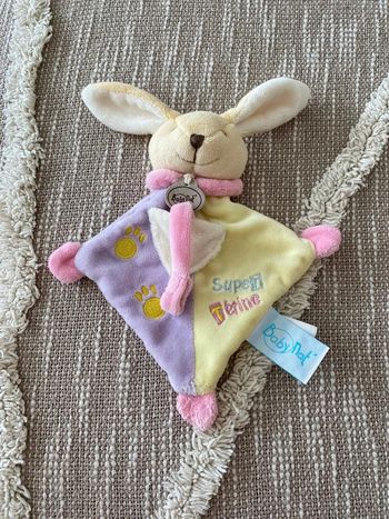 Peluche doudou plat 20cm babynat lapin jaune rose beige et violet très bon état