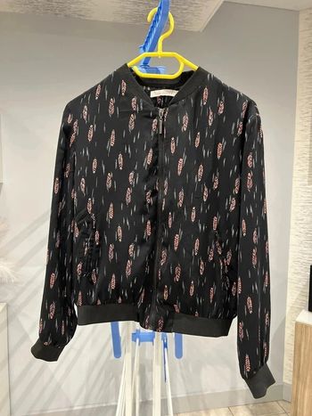 Veste motifs plumes