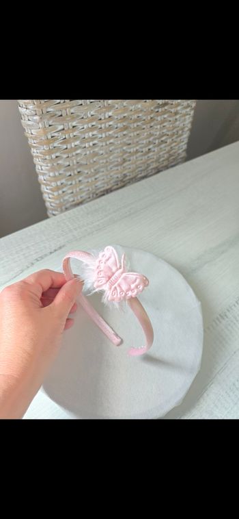 Serre tête papillon rose