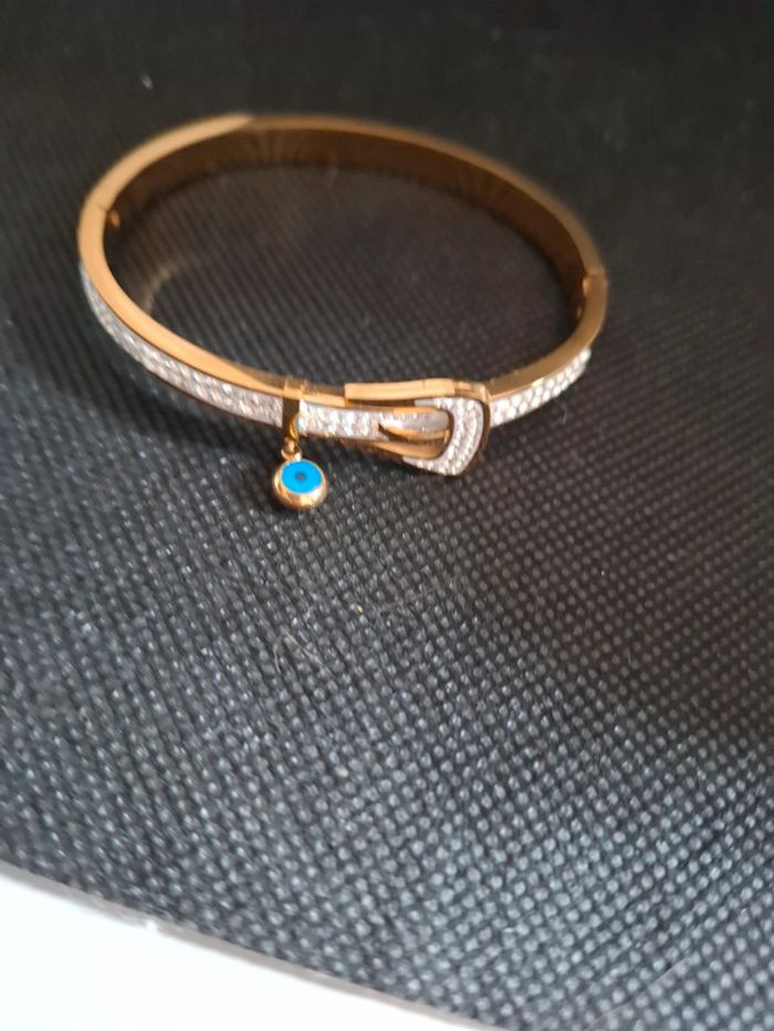 Bracelet acier inoxydable neuf avec etiquette motif œil. rigide