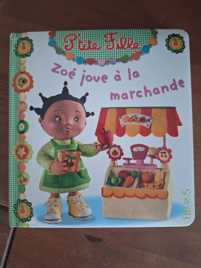 Zoé joue à la marchande