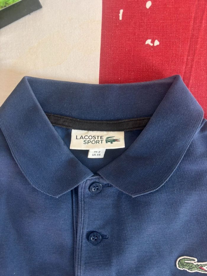 Polo Lacoste taille xs bleu et noir - photo numéro 3