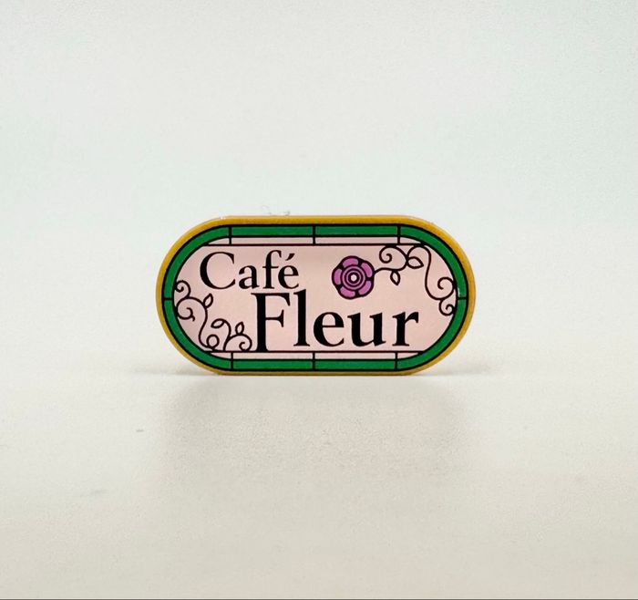 Lego Accessoires Space : Tile round 2x4 Bleu ovale Logo Café Fleur - NEUF