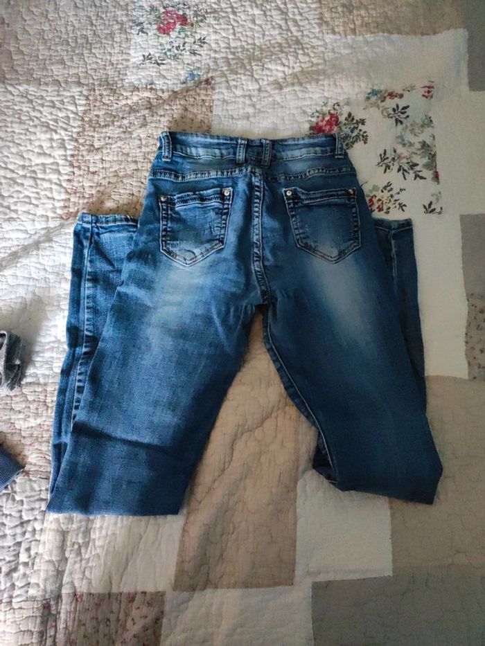 Très beau jeans effet troué - photo numéro 5