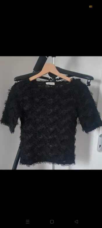 Pull duveteux, à poils noirs, semi ajouré "Naf Naf"