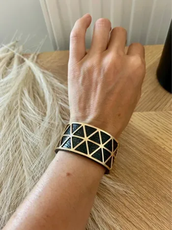 Très beau bracelet manchette doré lien réversible doré et noir