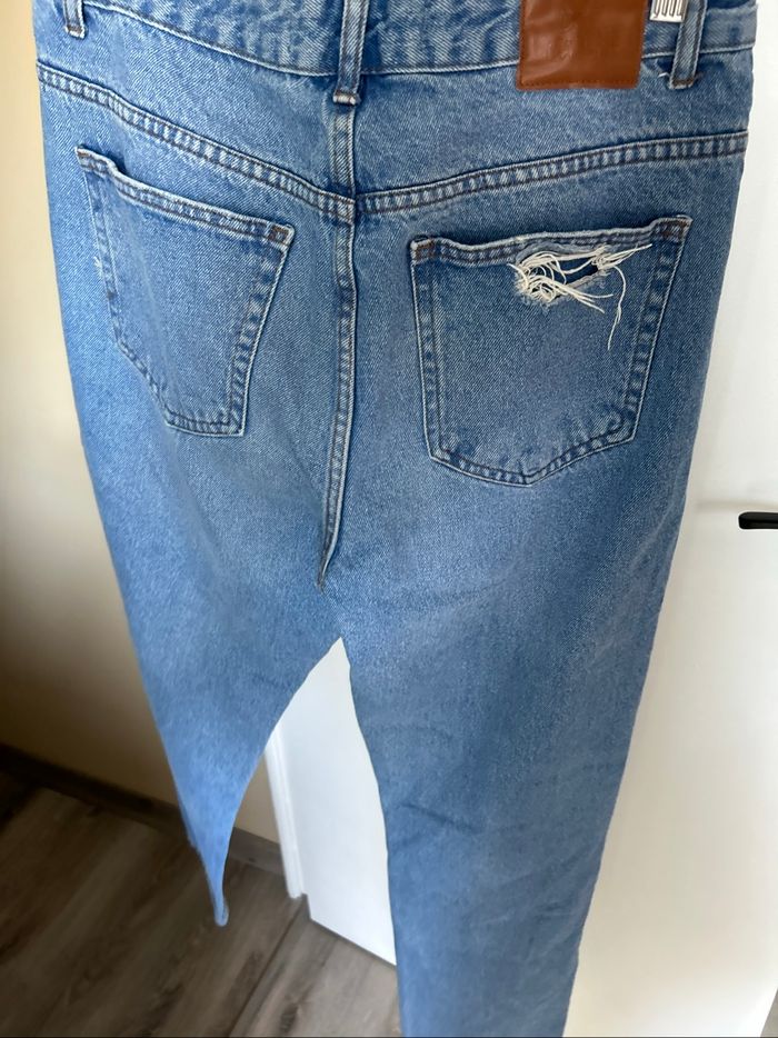 Mom déchiré - photo numéro 3