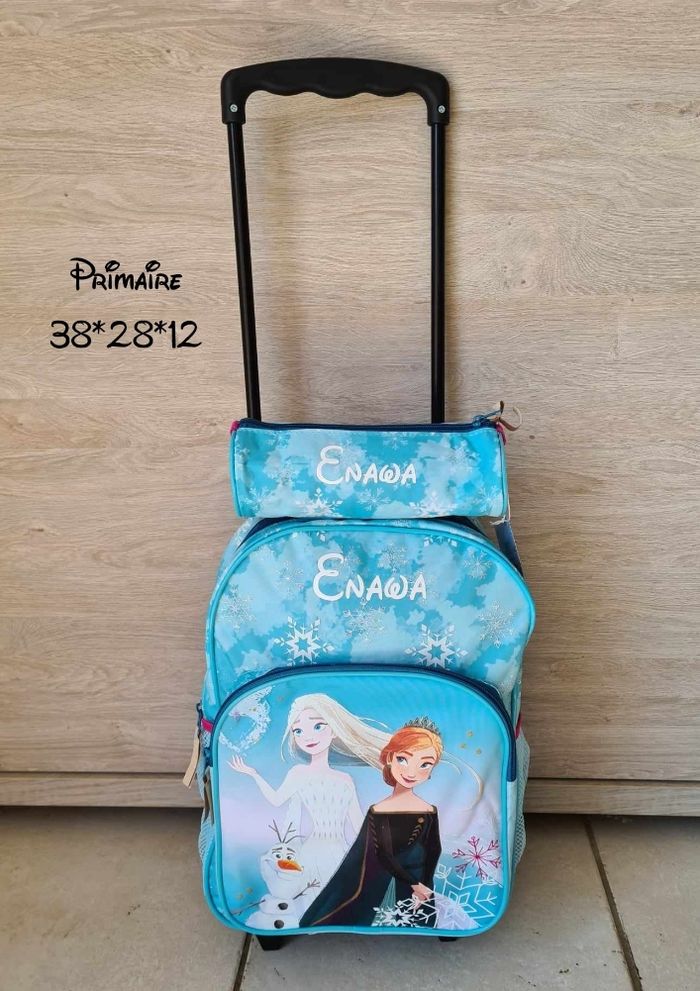 Sac primaire à roulettes reine des neiges + trousse assortie
