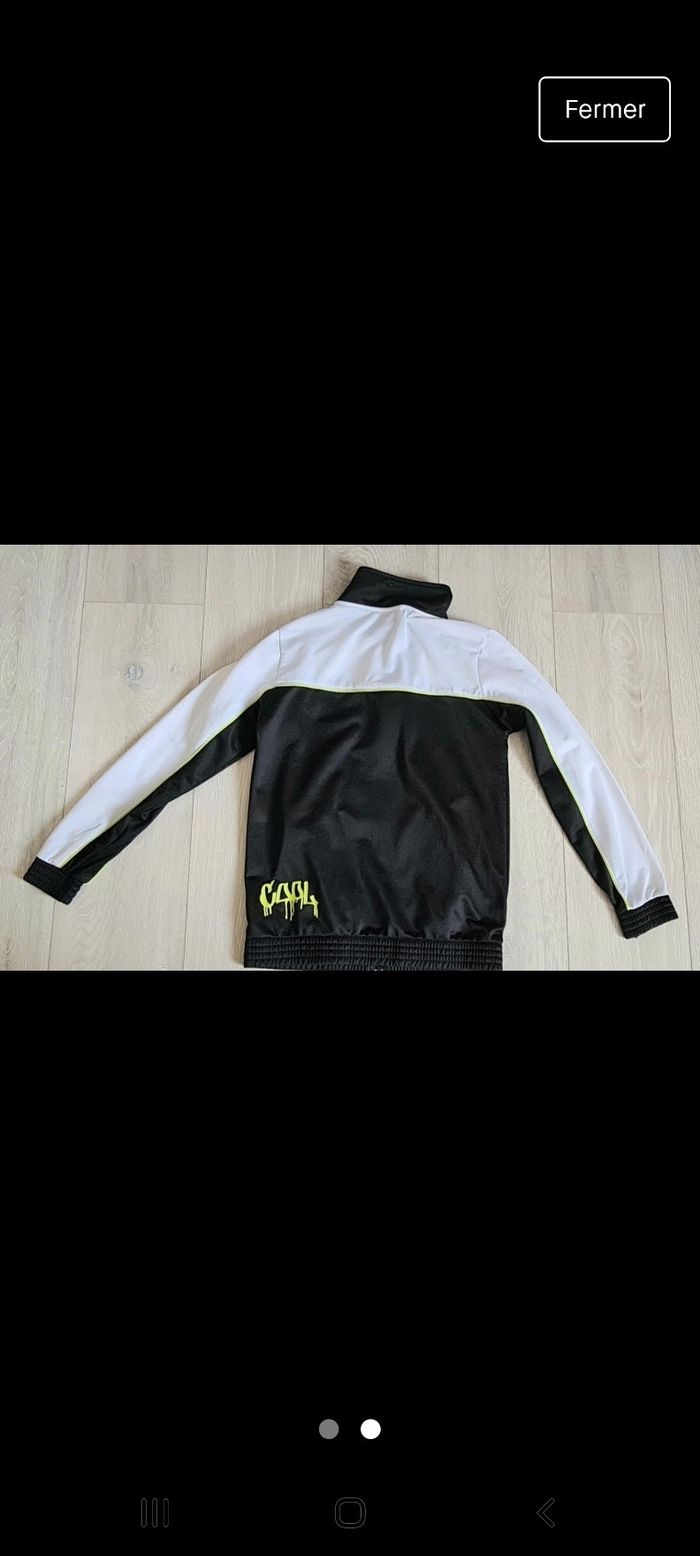 Veste de jogging  blanche et noire comme neuve 10-12 ans - photo numéro 2