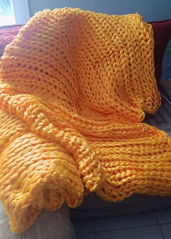 Plaid ou couverture grosses mailles orangé