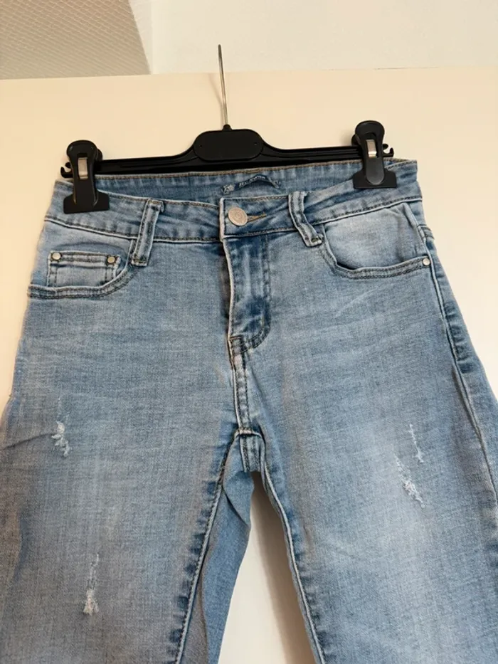 Jean slim bleu en très bon état effet déchiré taille 36 by swan - photo numéro 2