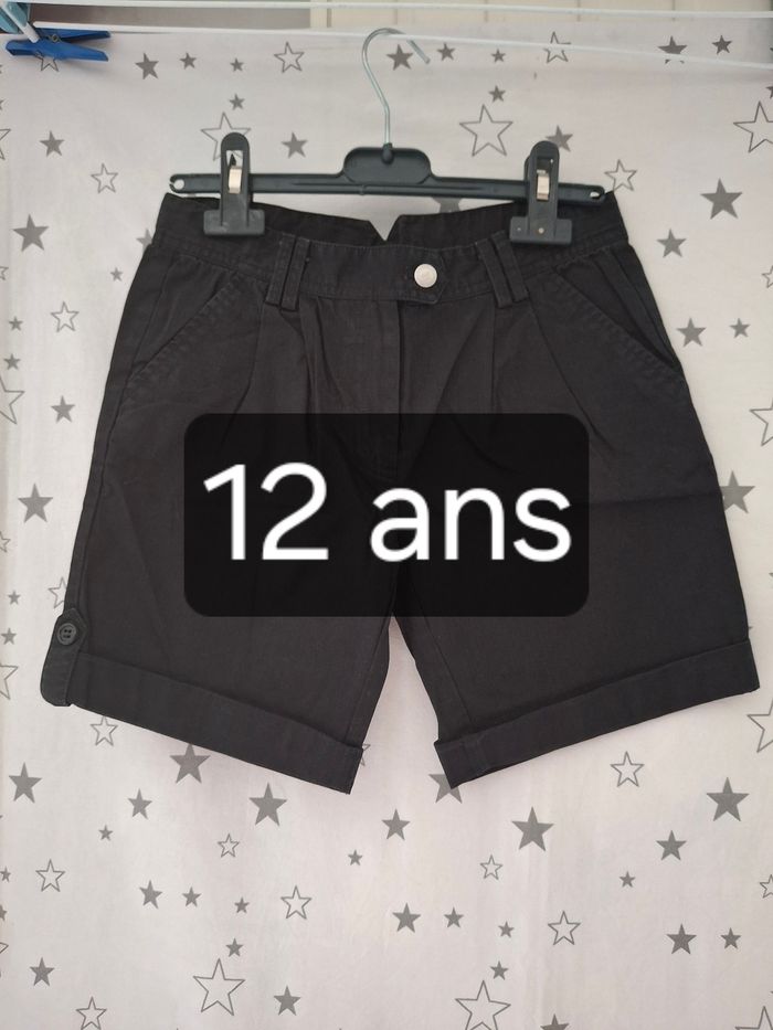 Short long noir réglable 12 ans Kaludo
Très bon état ni trous ni tache