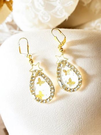 Magnifique paire de boucles d'oreilles pendantes papillon doré