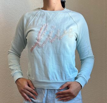 Pull sweat léger col rond Lacoste live bleu clair intérieur polaire devanlay taille S/36