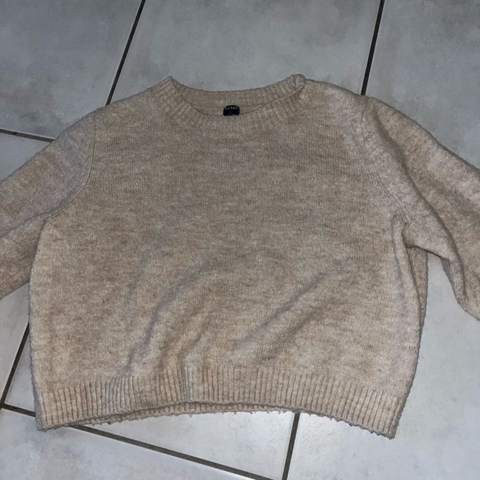 Pull beige manche longue