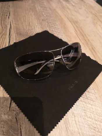 Lunette Prada argenté et branche noir et blanche