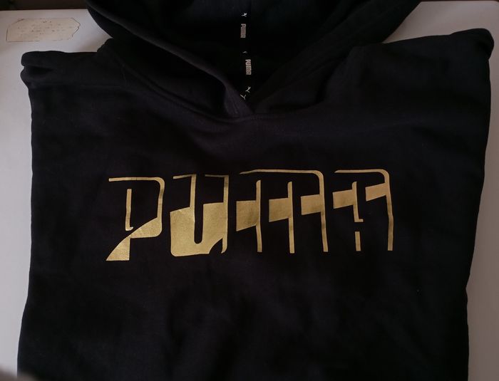 Sweat à capuche. Taille L. Noir et or . Coton et polyester . État neuf - photo numéro 2