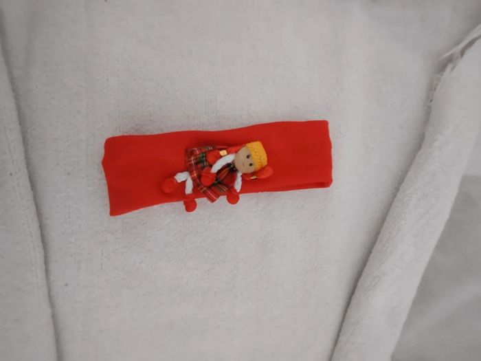 Bandeau avec petite poupée