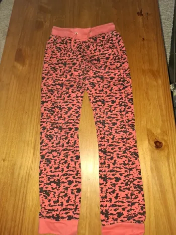 Jogging corail et noir 9/10 ans