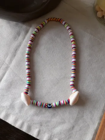 Collier perle,coquillage ,oeil bleu