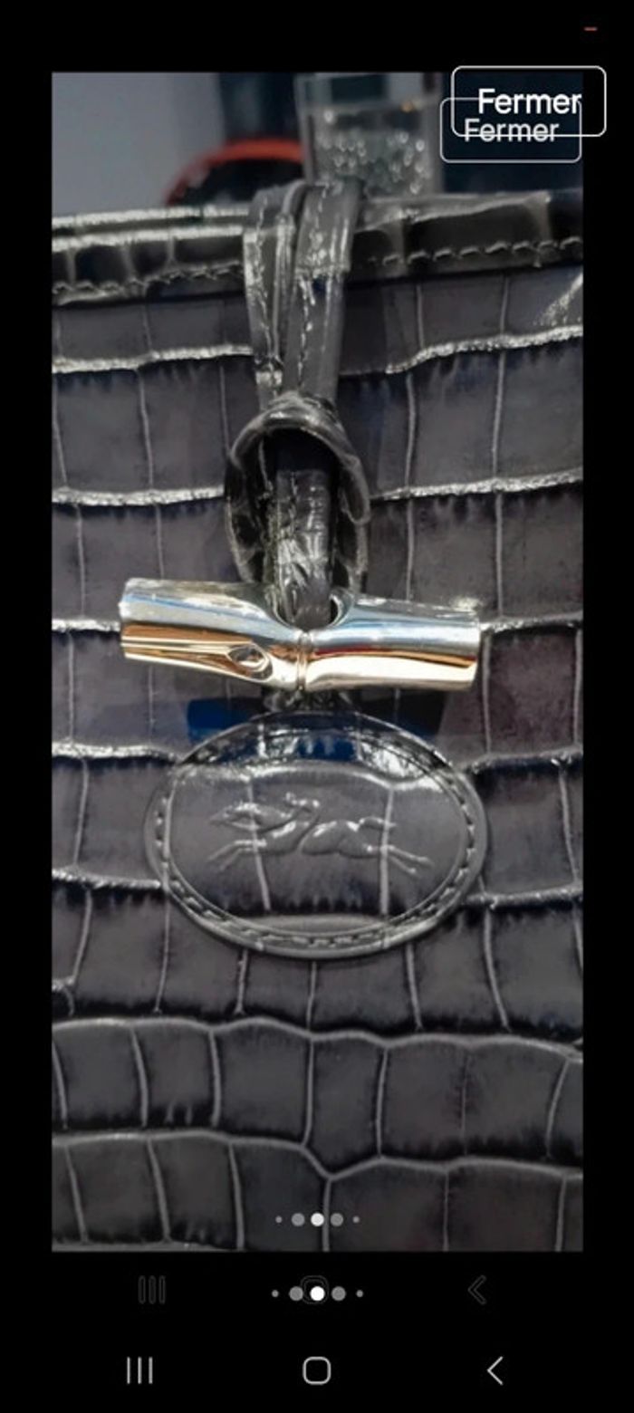 Sac longchamp grande capacité en porte épaule en cuir croco l état du sac en photo 
26x37x12 - photo numéro 9