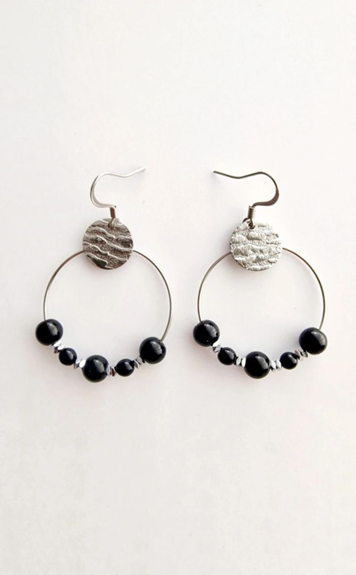 Boucle d'oreille créole noir et argenté