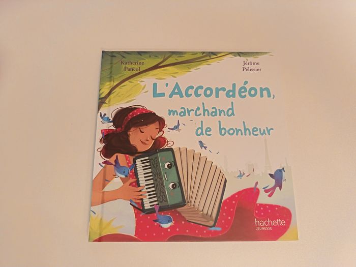 Livre " L'accordéon marchand de bonheur" de la collection Hachette