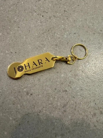 Porte clé doré, très bon état