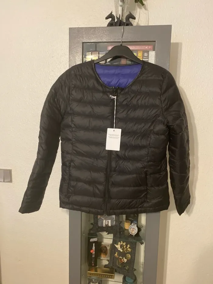 superbe veste en plume réversible tiens bien chaud taille 42 neuve