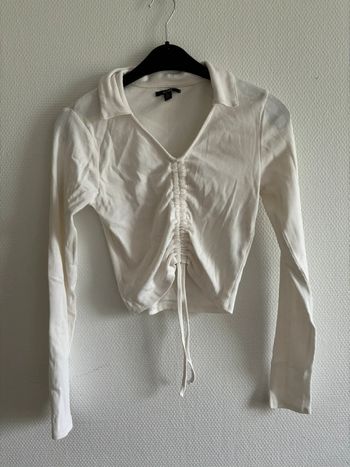 Blouse blanche avec cordon