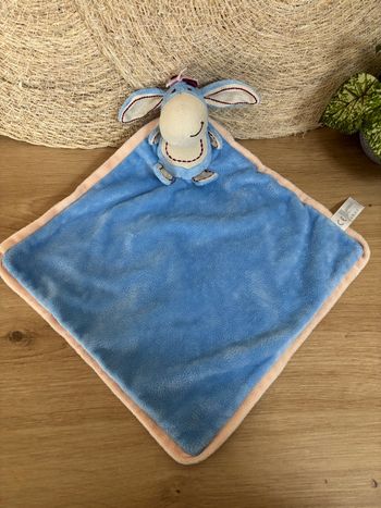 Doudou plat âne bourriquet bleu contour beige Disney