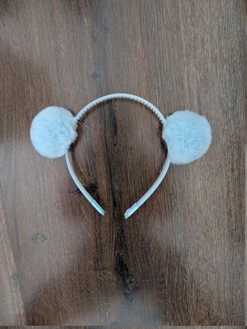 Serre tête avec pompons bleus