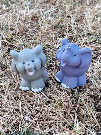 Couple elephants little people
