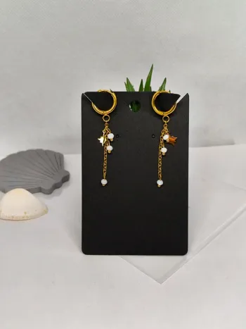 Boucles d'oreilles dorées étoile polaire et perles blanches