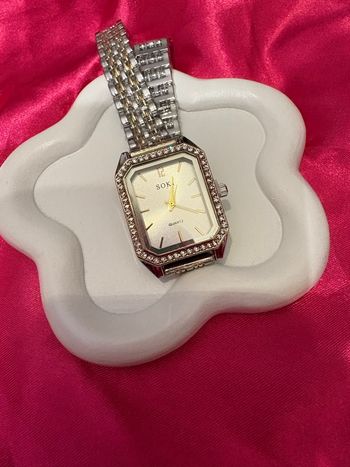 Élégante montre argenté et doré quartz 