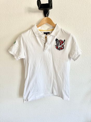 Polo Tommy Hilfiger blanc Taille 16 ans/S avec logo “NYC”