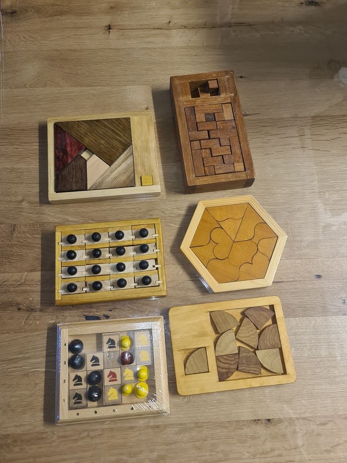 Neufs et comme neufs 6 petits casses têtes en bois divers