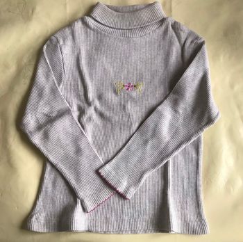 Pull à col roulé fleuri