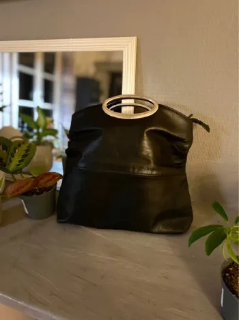 Sac vintage cuir porté main Heyraud