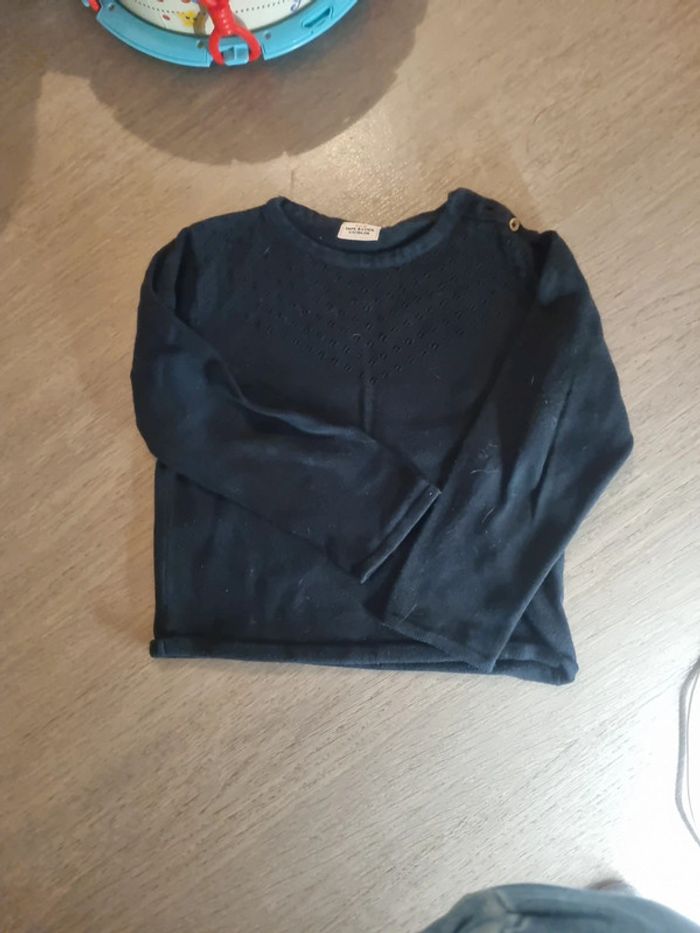 Pull noir tape à l'oeil