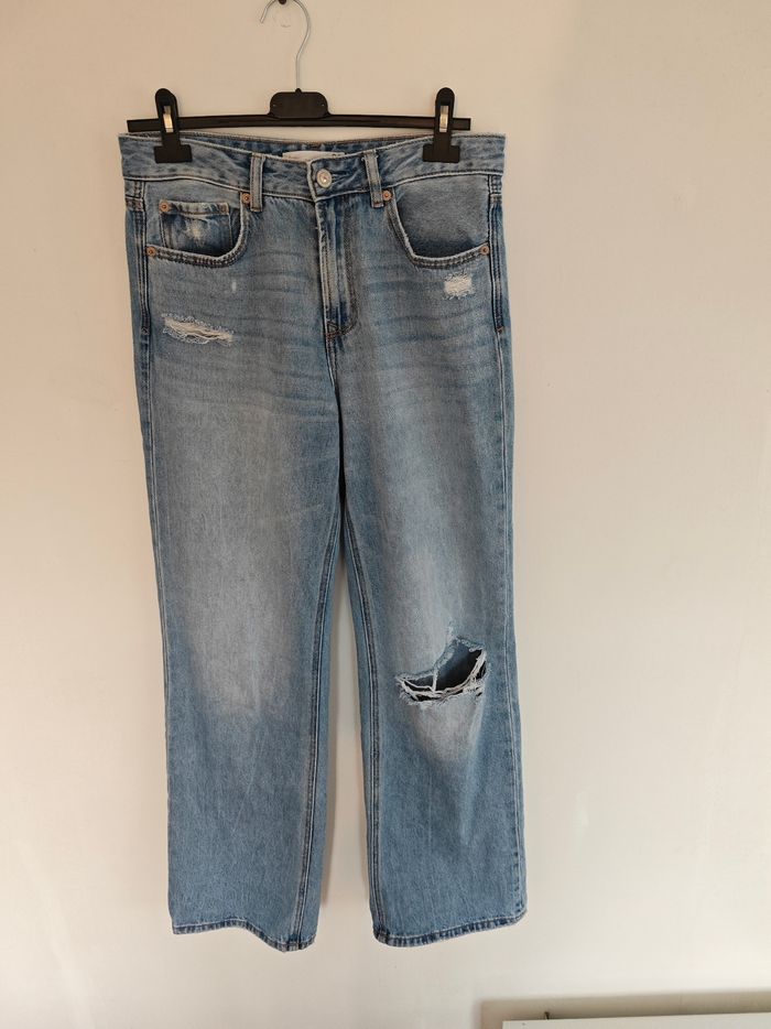 Jeans bleu troué parte éléphant Taille 38