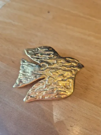 Broche migration Charles Duret