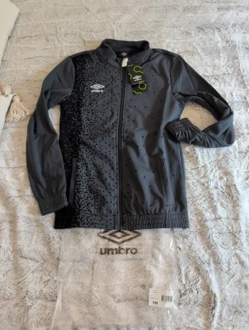 Veste de survêtement umbro. Gris. Neuf. 12 ans