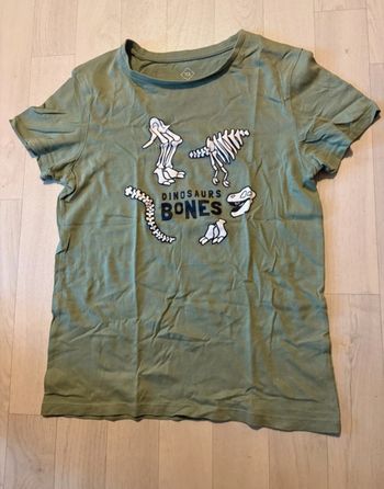 T-shirt 9/10 ans tex kaki motif os de dinosaures très bon état
