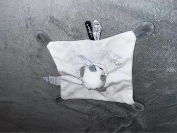 Doudou panda neuf dans sa boîte
