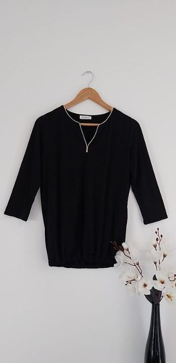 Jolie blouse noire et dorée