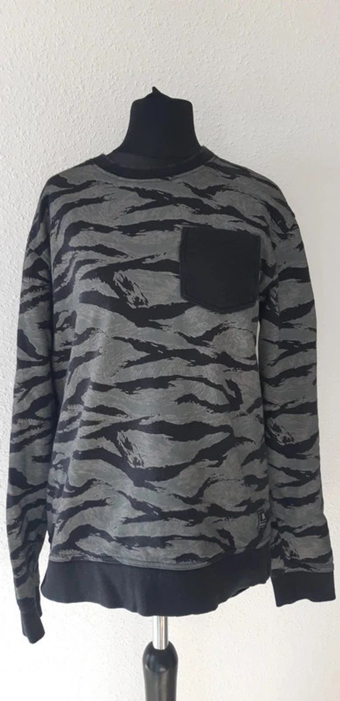 Pull kaki et noir taille L