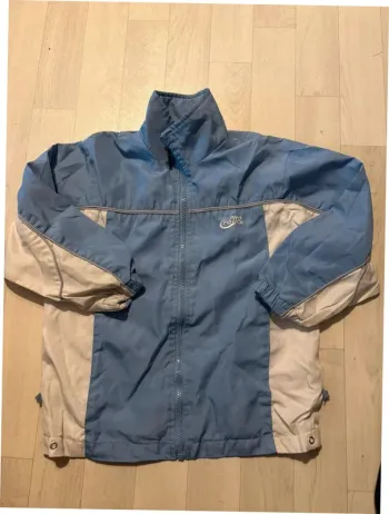 Veste de jogging bleu et blanche 6 ans pro touch très bon état