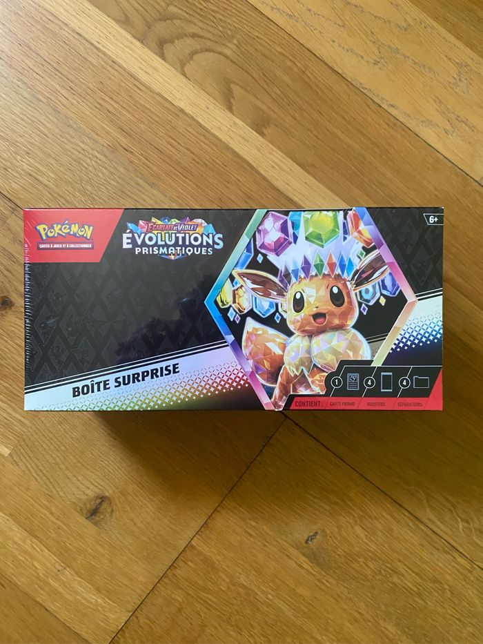 Coffret pokémon boîte mystère évolution prismatique